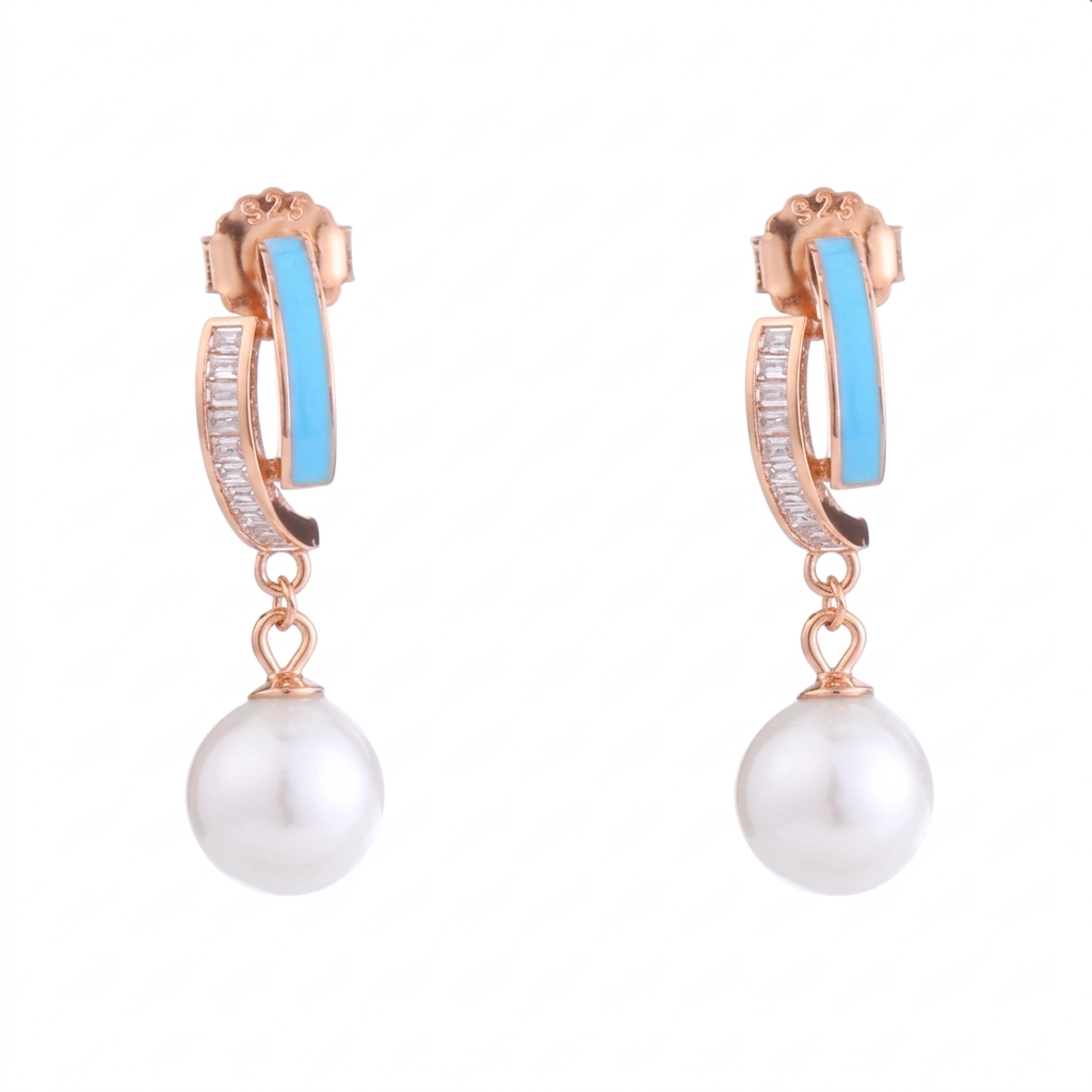 Pair of earrings with rose gold hoop, blue gemstone, and pearl drop on a white background